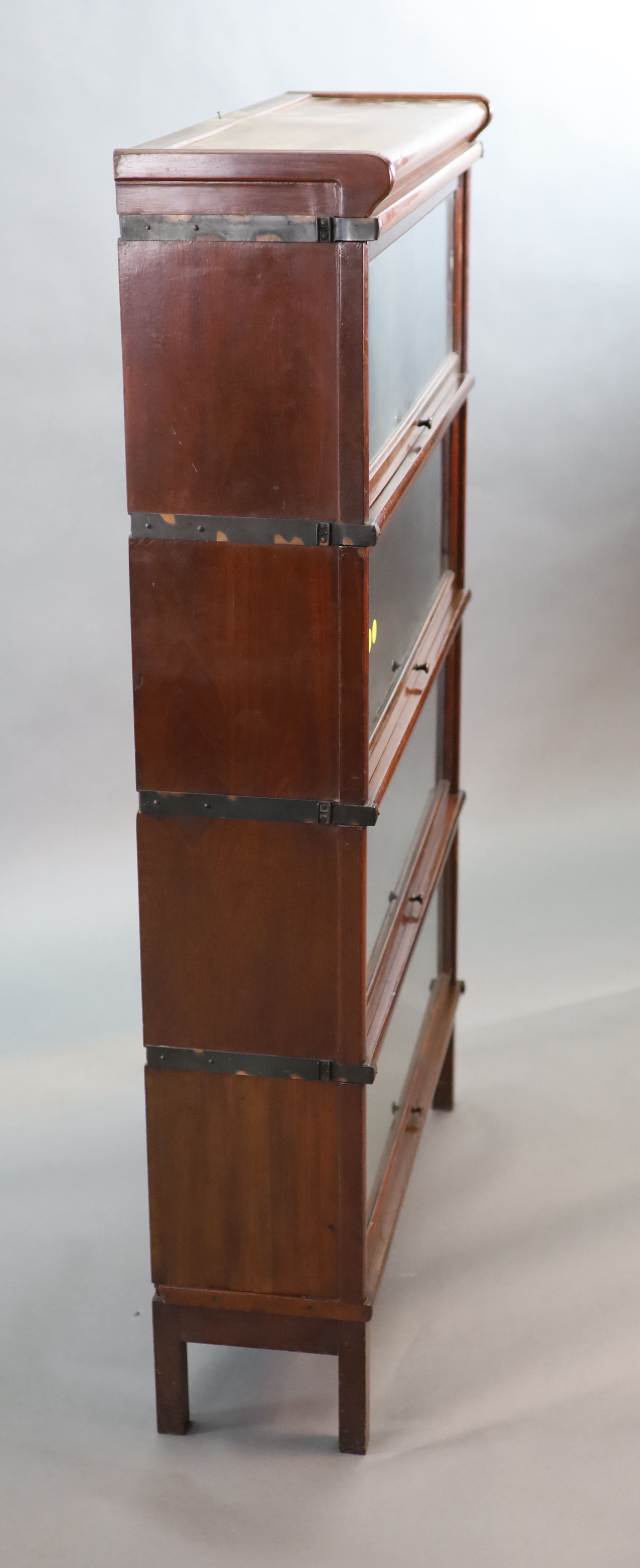 A Globe Wernicke mahogany four section bookcase, W.86.5cm D.27cm H.143cm